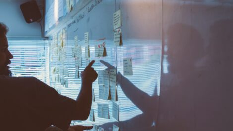 People creating a strategy on a whiteboard